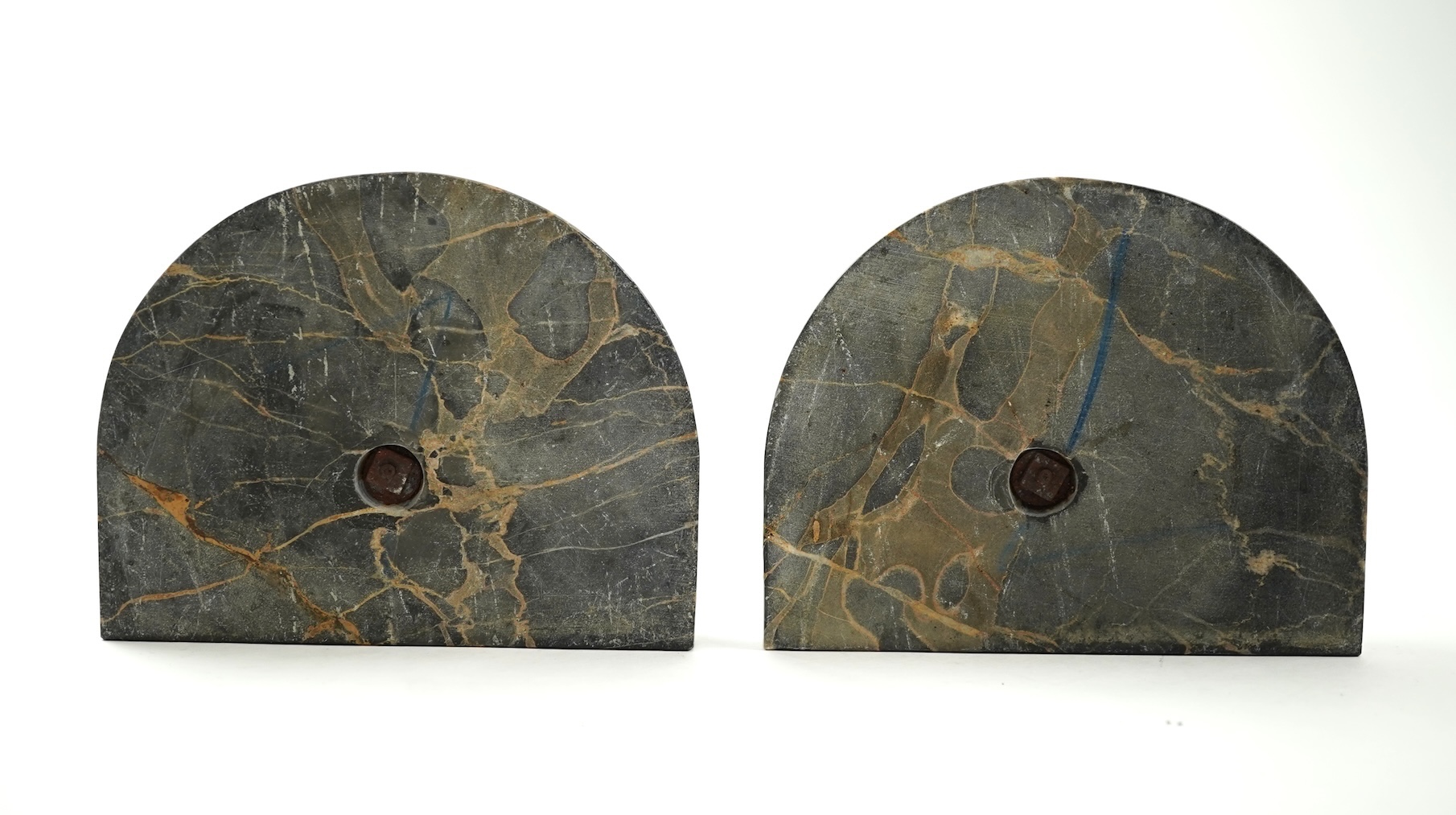 A pair of bronze peacock bookends, with remains of coloured pigments, marble plinths, signed R. Leclerc, 20cm